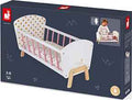 Dark blue packaging for a white wooden doll cradle with pink slats, wooden legs, and a polka-dot headboard.