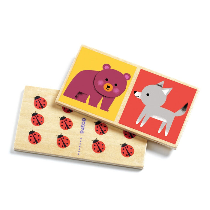 Two wooden domino tiles featuring a purple bear on yellow, a grey wolf on red, and red ladybugs on natural wood.