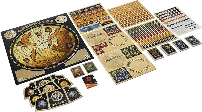 Circular desert map board, character tokens, beige battle wheels, and decks of cards for a tabletop strategy game.