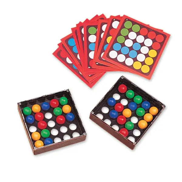 Two square grid boxes with colored balls and a stack of cards featuring matching red, blue, green, and yellow circles.