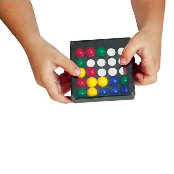 Hands holding a black square puzzle box containing red, green, yellow, and blue marbles in a grid.