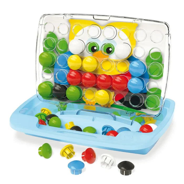 Open blue travel case with an owl picture under a clear pegboard and chunky, colorful plastic pegs.
