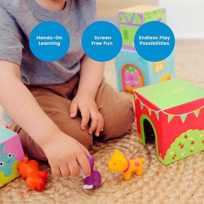 Child playing with colorful illustrated nesting cubes and small rubber animal figures on a woven rug.
