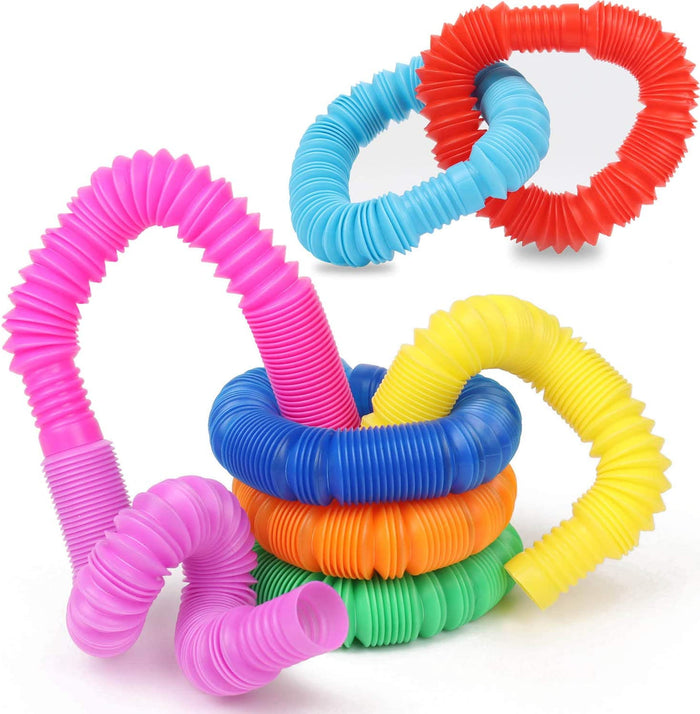 Colorful flexible accordion tubes in pink, blue, yellow, orange, and green, arranged in loops and curved shapes.