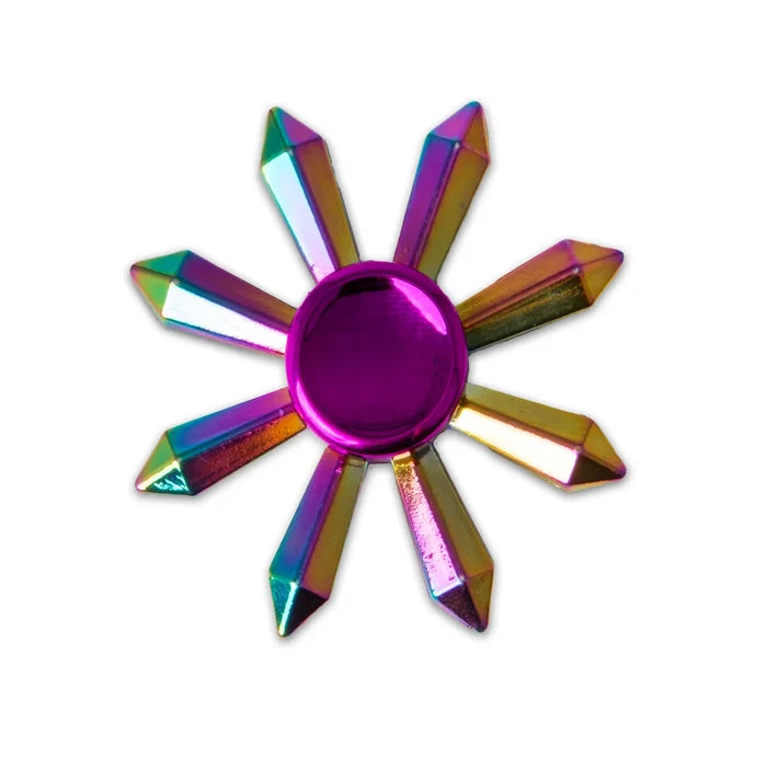 Iridescent rainbow fidget spinner with eight crystal-shaped arms and a central metallic purple circular hub.