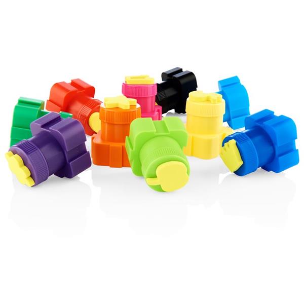 Vibrant paint pots in purple, green, and orange with yellow foam stamps in shapes like stars and flowers on top.