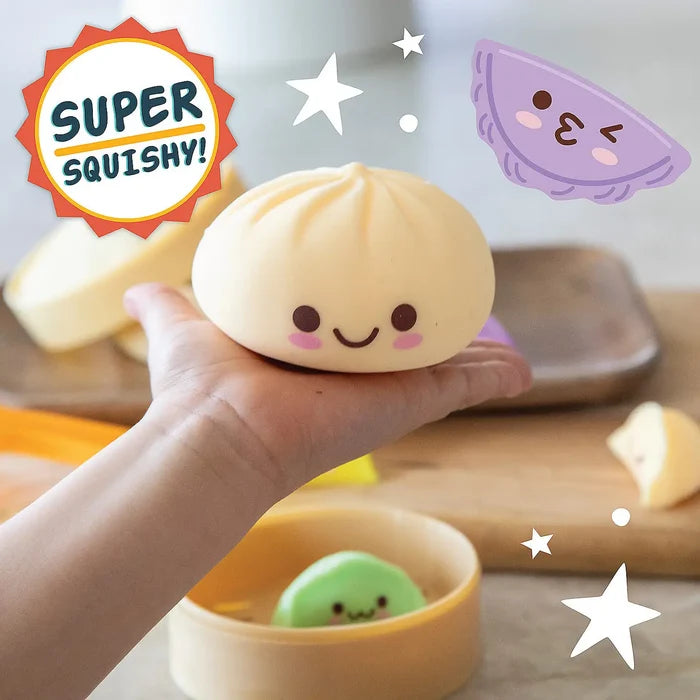 Hand holding a smiling cream-colored bun squishy toy with a green bun in a steamer and a Super Squishy badge.