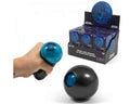 Hand squeezing a black ball to reveal a blue gel bubble. Includes a display box of toys in blue and purple packaging.