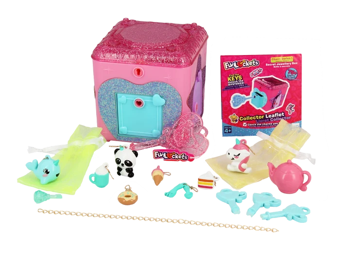 Pink glittery jewelry box with teal heart door, animal and dessert charms, blue plastic keys, and a gold chain.