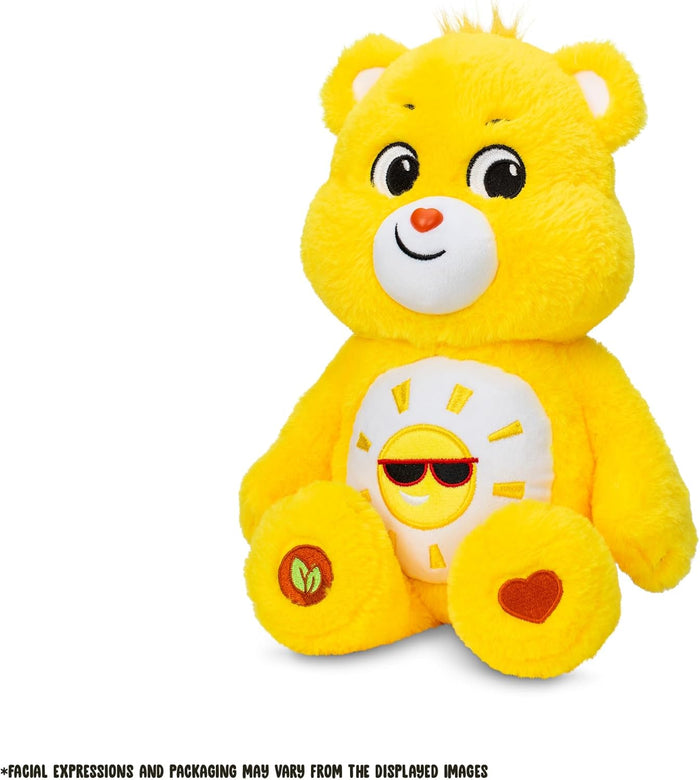Yellow plush bear with a sun wearing sunglasses on its belly, plus heart and leaf emblems on its feet.