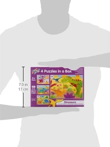 Purple Galt Dinosaurs puzzle box showing four colorful dinosaur scenes, held by a person with a 7-inch scale.
