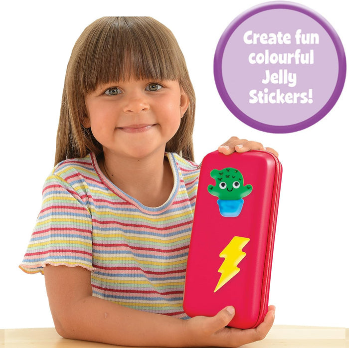 A young girl holding a red case decorated with a green cactus and yellow lightning bolt jelly stickers.