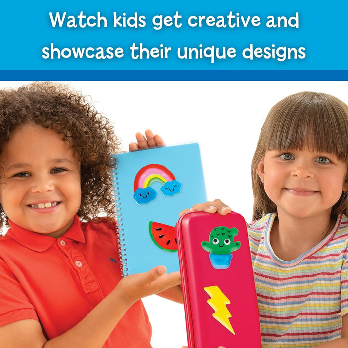 Two children holding a notebook and pencil case decorated with colorful jelly stickers of a rainbow and cactus.