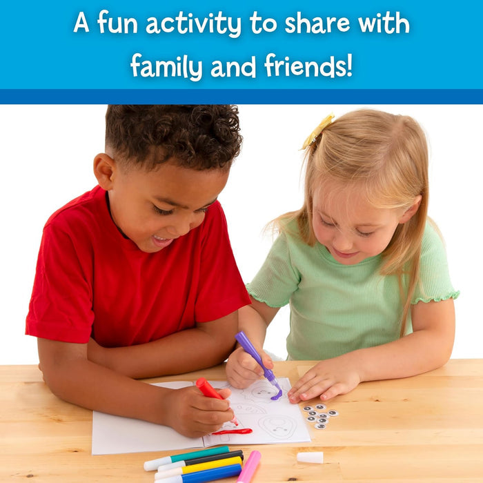 Two children coloring jelly sticker sheets with colorful markers and googly eyes at a wooden table.