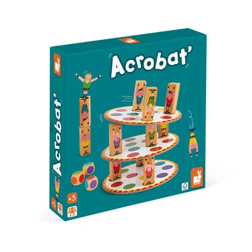 Teal game box showing wooden acrobat figures balancing stacked, multi-colored dotted discs and three dice.