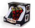Black gear-based cube puzzle with yellow and red gears in a branded display box.