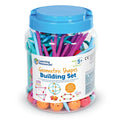 Clear jar with blue lid filled with colorful plastic rods and orange connectors for building 3D geometric shapes.