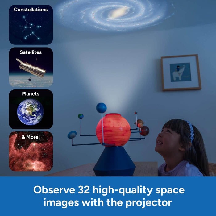 Solar system toy with blue base, glowing orange sun, and orbiting planets projects a galaxy onto the ceiling.