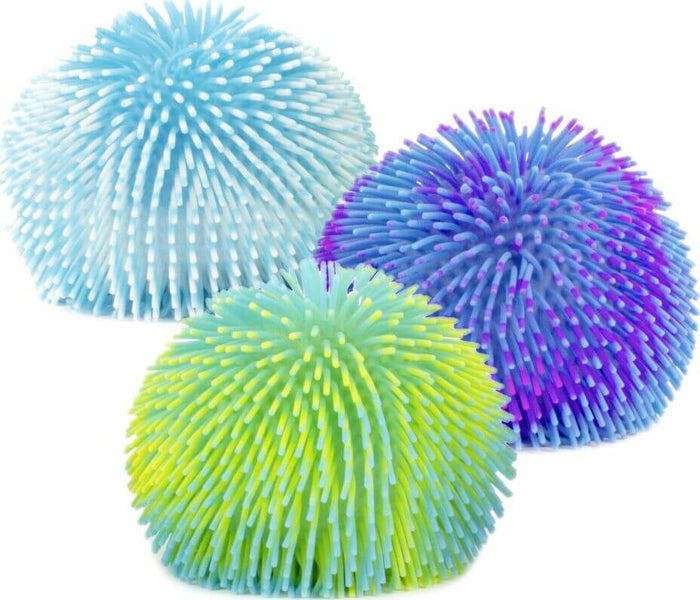 Three colorful, squishy puffer balls with soft rubber spikes in light blue, blue-purple, and green-yellow.