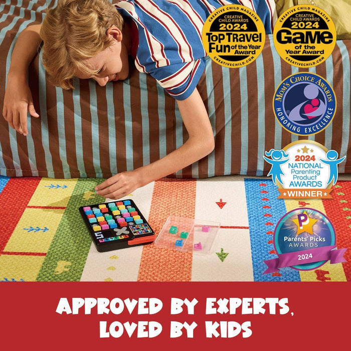 Child plays with a handheld black Sudoku game with colorful square buttons, featuring several 2024 toy award seals.