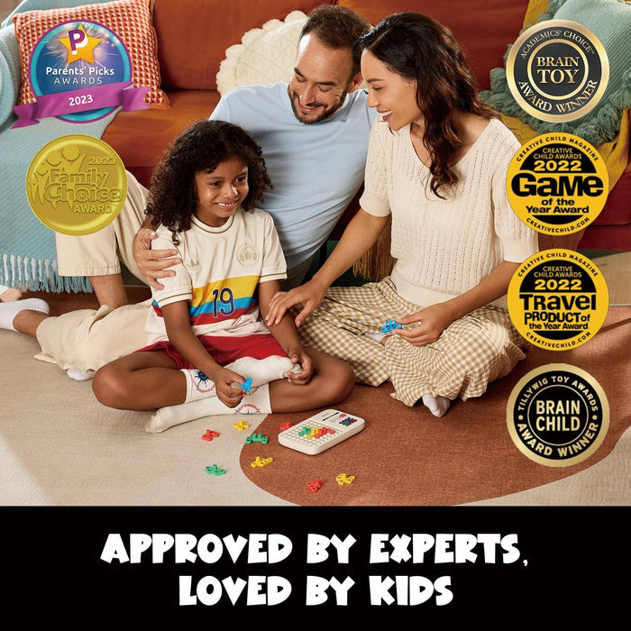 A family plays with a handheld electronic puzzle and colorful blocks on a rug, surrounded by various toy award seals.