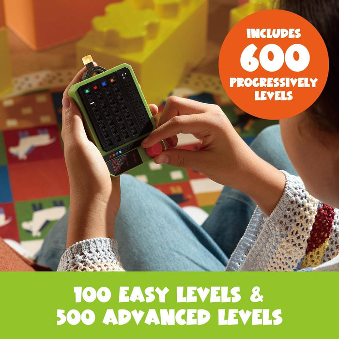 Person playing a lime green handheld electronic logic game with colored lights and 600 puzzle levels.