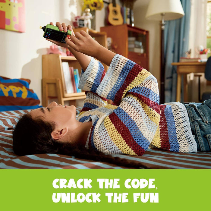 Person lying on a bed playing a green handheld electronic puzzle game with a color grid screen and buttons.