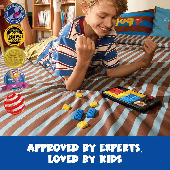 Boy playing with a handheld sliding puzzle on a striped bed with colorful blocks and expert-approved award seals.