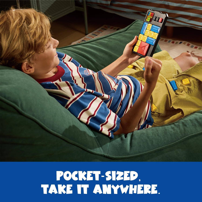 A child on a beanbag plays a handheld black sliding puzzle game with colorful blocks. Text reads POCKET-SIZED.