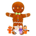 Brown gingerbread man hand puppet with white icing details and four finger puppets: fox, cow, woman, and horse.