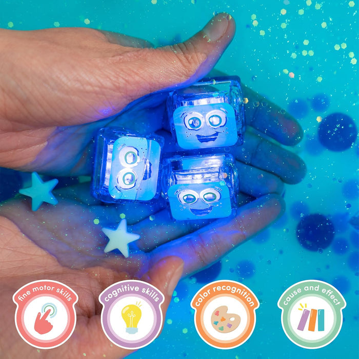 Hands holding three glowing blue cubes with faces over glittery water, with icons for developmental skills below.