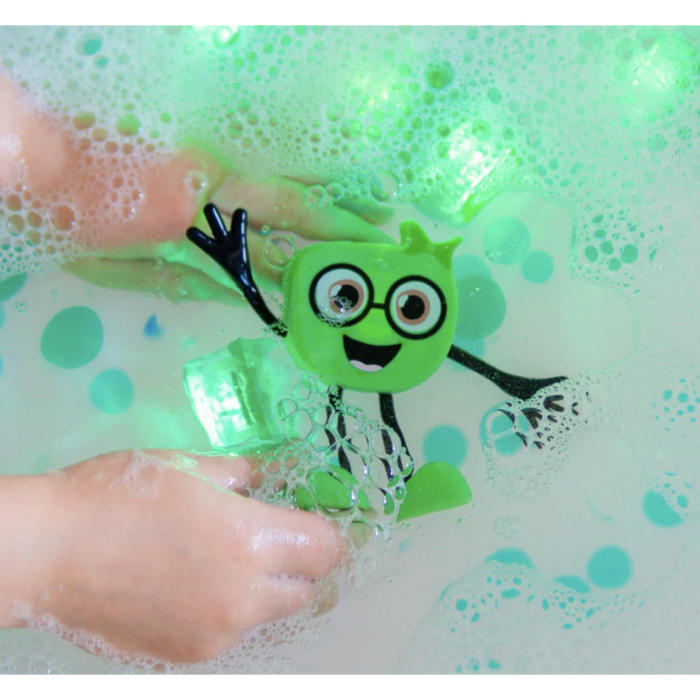 Green square character with glasses and black limbs in a bubbly bathtub with glowing green light-up cubes.