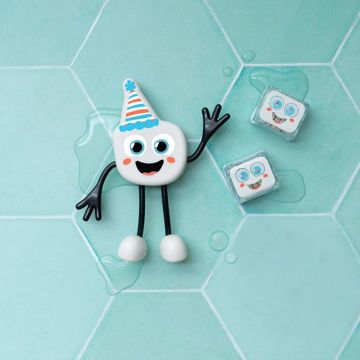 A white marshmallow-shaped character with a striped party hat and two light-up cubes on a teal hexagonal tile background.
