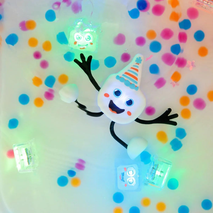 White light-up character with a striped party hat and happy face, floating in water with colorful gel beads.