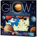 Dark box showing pale green glow-in-the-dark stars and colorful planet stickers through a clear display window.