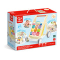 Packaging for Hape Grow-with-Me Push Walker showing the wooden walker and illustrations of its three play stages.