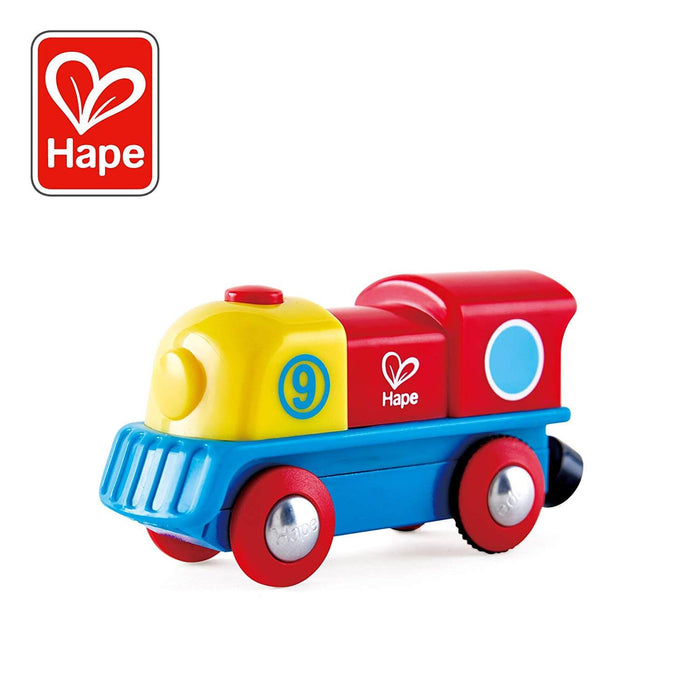 Colorful toy steam engine with yellow front, red cab, blue base, red wheels, and the number 9 on its side.