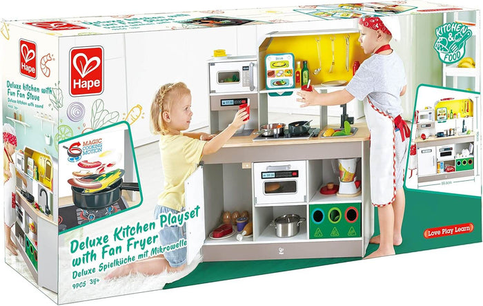Box for a grey and white wooden toy kitchen with a stove and microwave, showing two children playing with accessories.