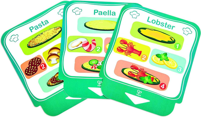 Three green Hape toy recipe cards with colorful step-by-step illustrations for pasta, paella, and lobster.