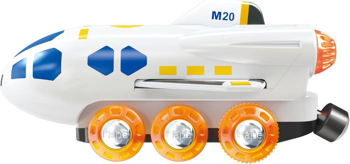White toy space shuttle with blue windows, yellow accents, and three orange wheels featuring silver hubs.