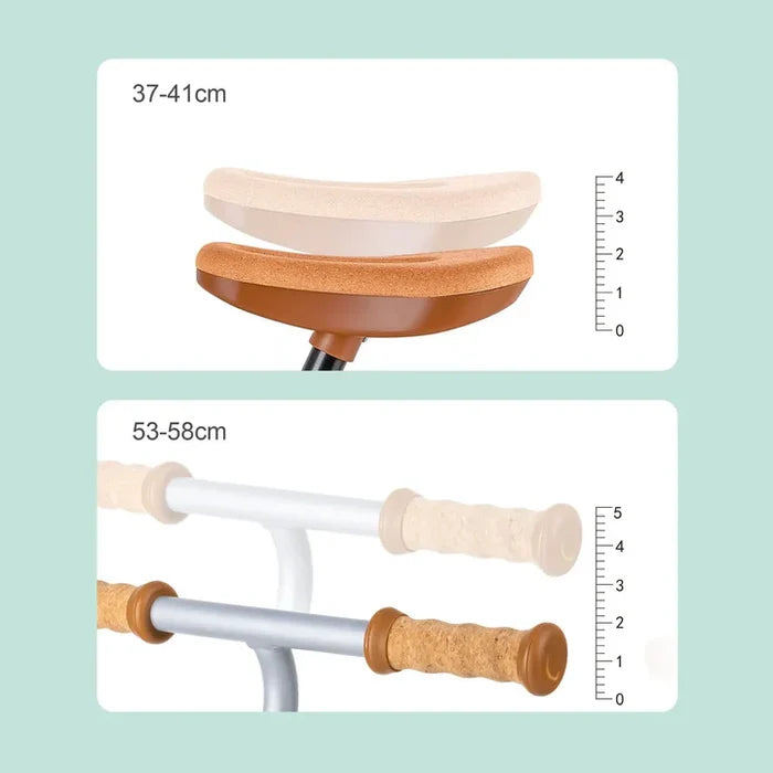 Diagram showing the height-adjustable cork saddle and handlebars of a balance bike with centimeter scales.