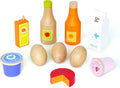 Assorted wooden toy food: juice bottles, milk carton, eggs, blue jam, pink yogurt, and a red cheese wedge.