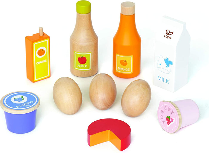 Assorted wooden toy food: juice bottles, milk carton, eggs, blue jam, pink yogurt, and a red cheese wedge.