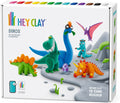 White box featuring six colorful clay dinosaurs, 15 multi-colored clay cans, and two sculpting tools.