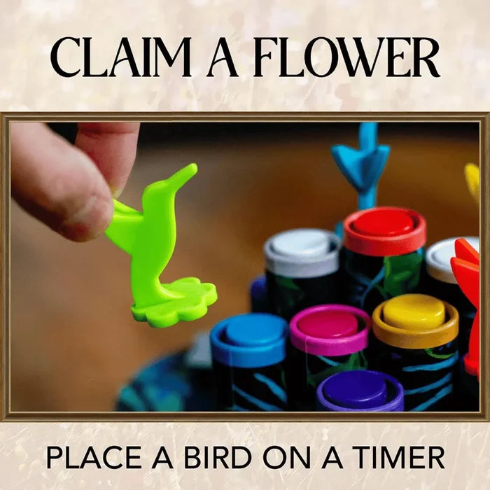 Hand placing a green hummingbird piece on colorful round timers. Text: Claim a Flower, Place a Bird on a Timer.