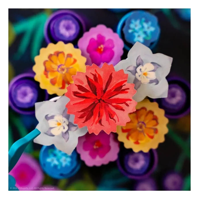 Colorful cluster of stylized paper flower game pieces in red, yellow, blue, and purple with painterly details.