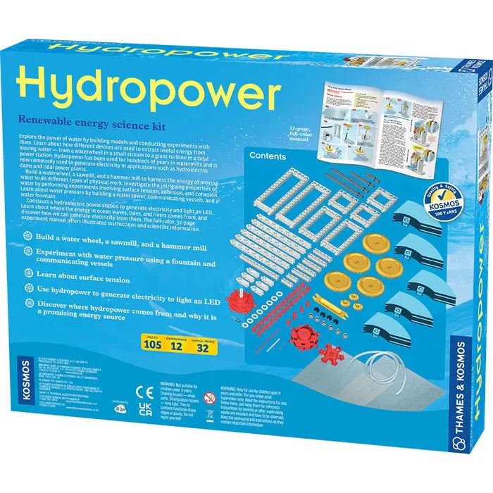 Blue box displaying yellow gears, blue plastic frames, red pieces, and an open manual with STEM experiment diagrams.