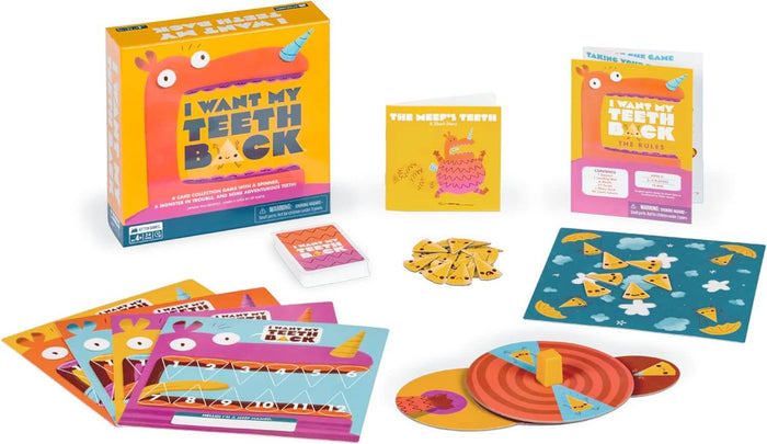 Colorful monster-themed board game with a yellow box, character boards, a spinner, and tooth-shaped tokens.