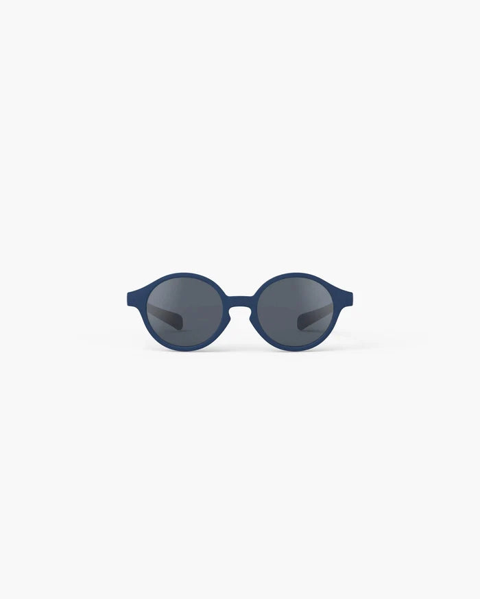 Navy blue round children's sunglasses with dark grey lenses, front view on a white background.