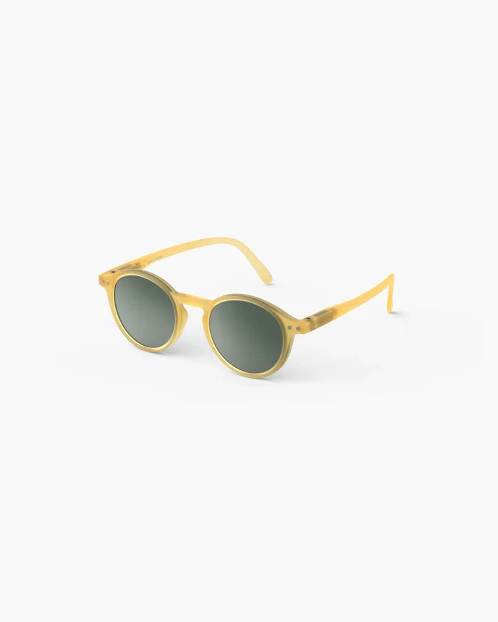 Round matte yellow translucent kids' sunglasses with dark green lenses and silver rivet details.